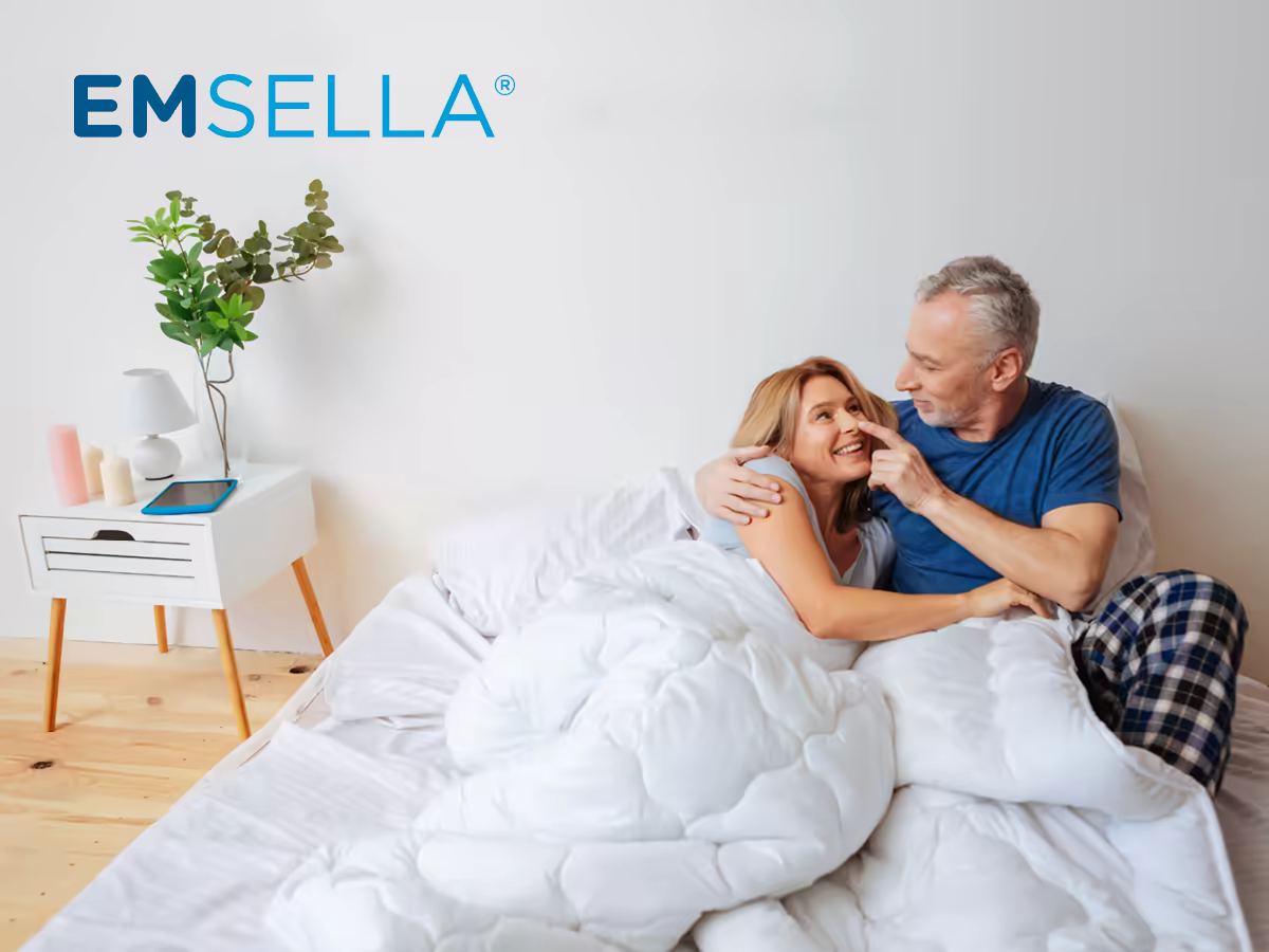 Smiling couple relaxing in bed